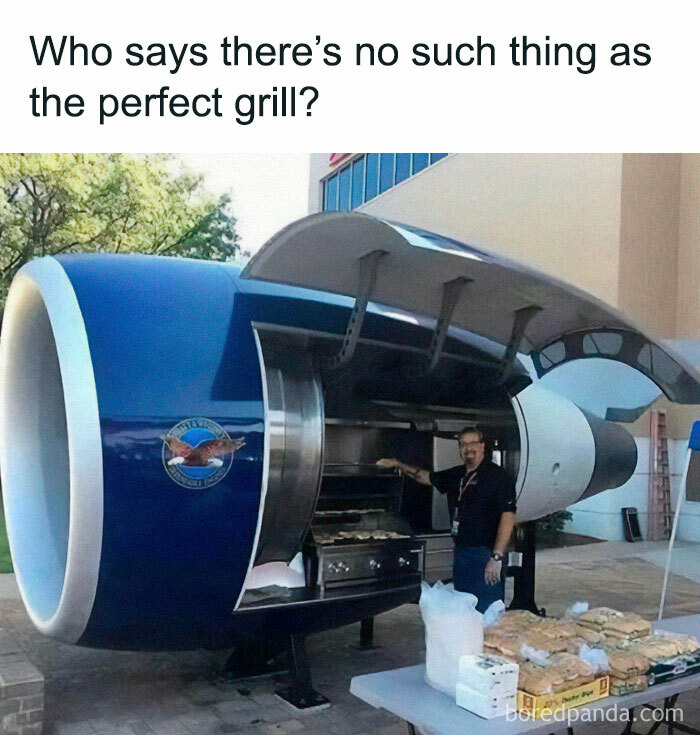 Man grilling food inside a repurposed airplane engine jet used as a unique aviation meme-themed barbecue grill.