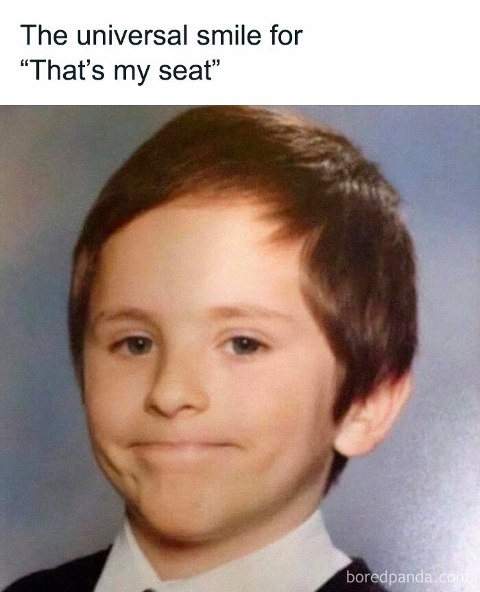 Young boy with a slight smile representing aviation memes about claiming a seat for people spending time in the air.