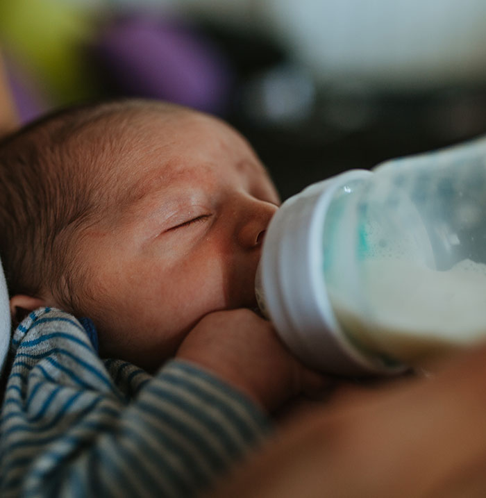 Baby peacefully drinking from a bottle, closely connected to woman's social experiment with US megachurches online. Baby peacefully drinking from a bottle, closely connected to woman's social experiment with US megachurches online.