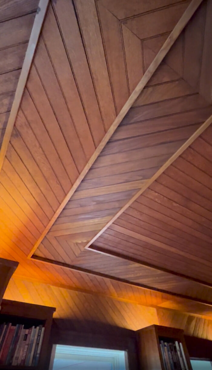 Intricately crafted wooden ceiling in a beautiful old house showcasing timeless craftsmanship and design details.