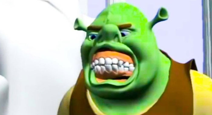 Unhinged behind-the-scenes photo of a green animated character with exaggerated facial expression ready to become a meme.