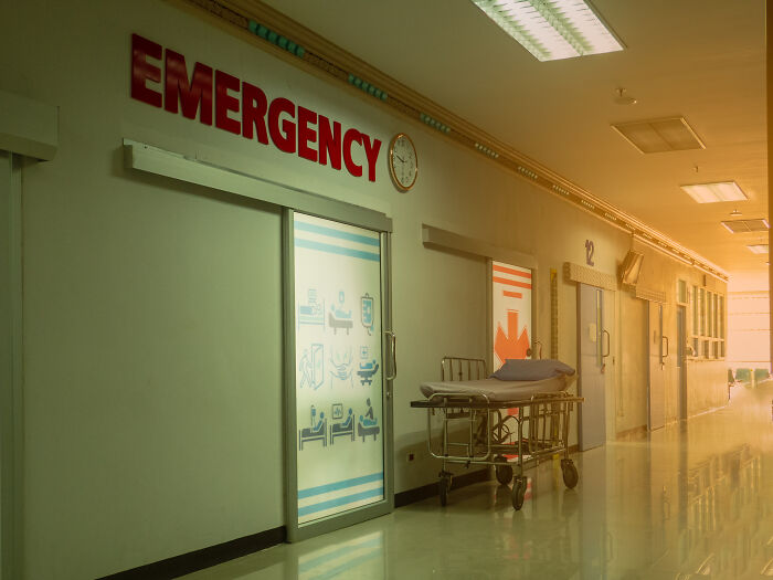 Emergency room hallway with a stretcher outside the door, illustrating patients saying eerie things haunting doctors.