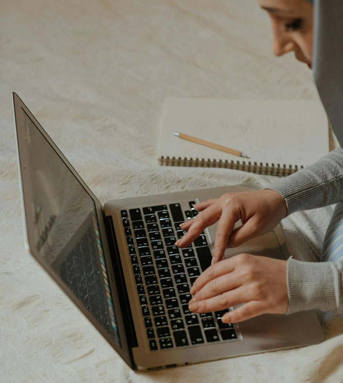 Person typing on a laptop, focusing on a story about a guy refusing to accept break-up after a romantic trip. Person typing on a laptop, focusing on a story about a guy refusing to accept break-up after a romantic trip.