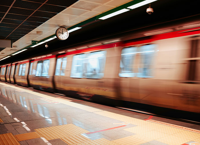 Blurred image of a train speeding through a modern subway station, symbolizing unexpected stories of life-changing moments.
