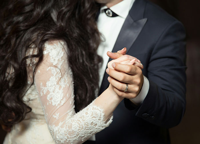 Couple holding hands and dancing, symbolizing unexpected stories of a bad day turning into a life-changing moment.