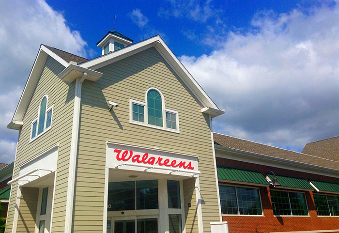 Photo of a Walgreens storefront under a blue sky, representing businesses that lost clients with poor decisions.