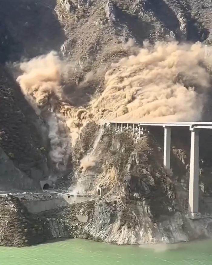 Dust and debris billow as China's ambitious bridge collapses into a rocky gorge just months after opening. Dust and debris billow as China's ambitious bridge collapses into a rocky gorge just months after opening.