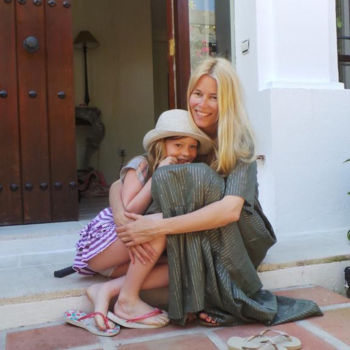 Claudia Schiffer&rsquo;s lookalike daughter sitting outdoors with blonde woman, both smiling and dressed casually