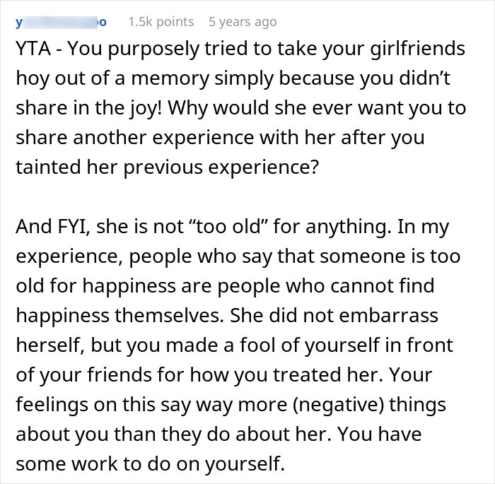 Screenshot of a Reddit comment criticizing a guy for mocking his girlfriend fangirling over a K-pop band and causing conflict.