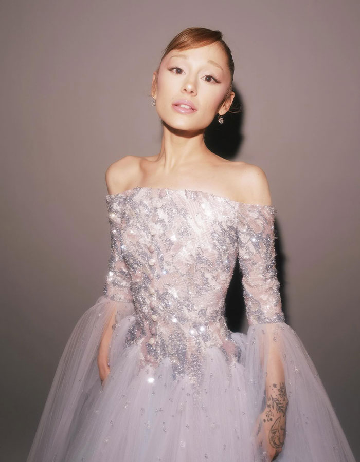 Ariana Grande posing in an embellished gown, raising concern about her health after Governors Award appearance.