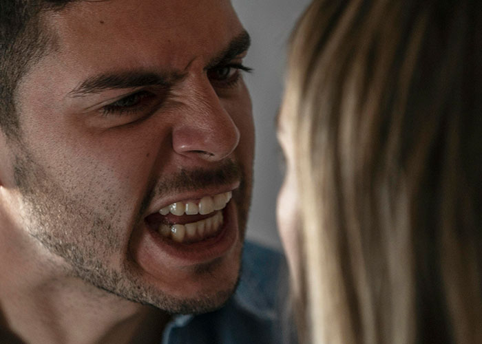 Man angrily shouting at a woman, depicting intense emotions in one of the weirdest and craziest ER stories.