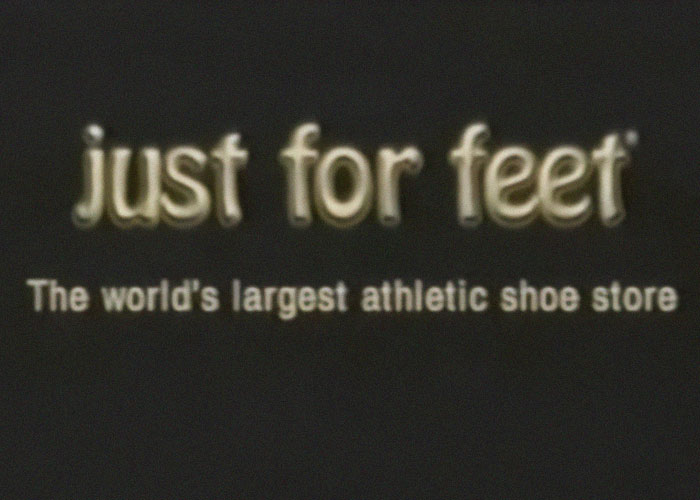 Just for Feet logo with tagline about being the world’s largest athletic shoe store, representing a company gone out of business.