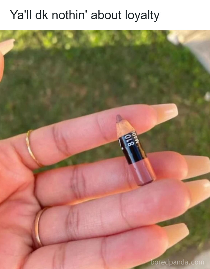 Hand holding a tiny lip liner pencil with long manicured nails, funny meme about makeup and the diva life.