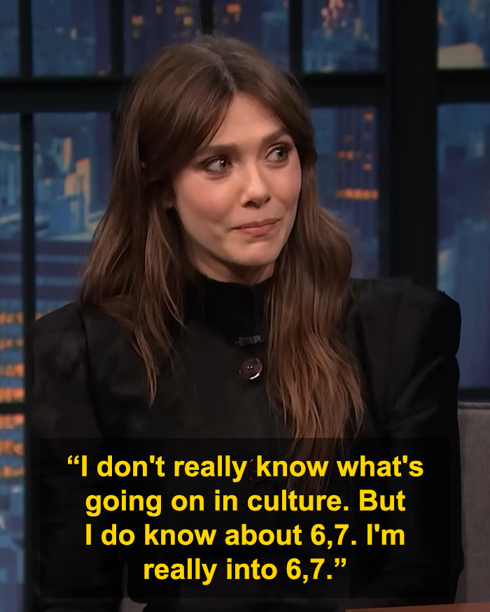 Elizabeth Olsen on a talk show discussing the viral 6,7 meme with a thoughtful expression.