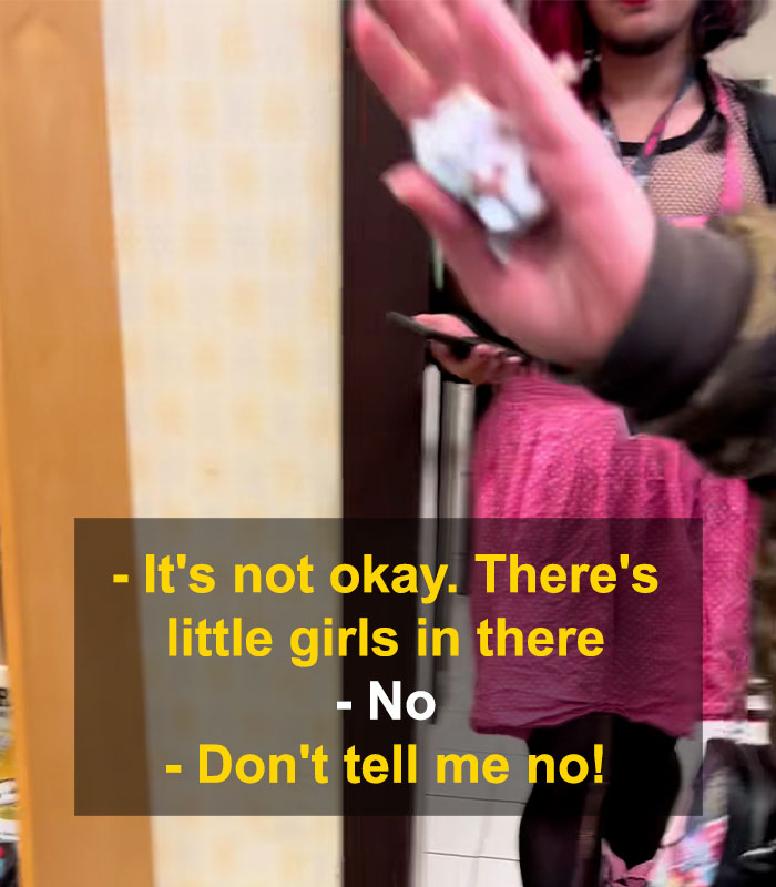 Woman upset confronting bearded trans man in women&rsquo;s restroom, sparking debate and tense interaction over bathroom access.