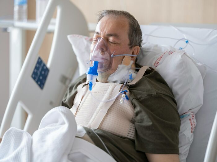 Elderly man with oxygen mask resting in hospital bed, illustrating heavy confessions people refused to reveal.