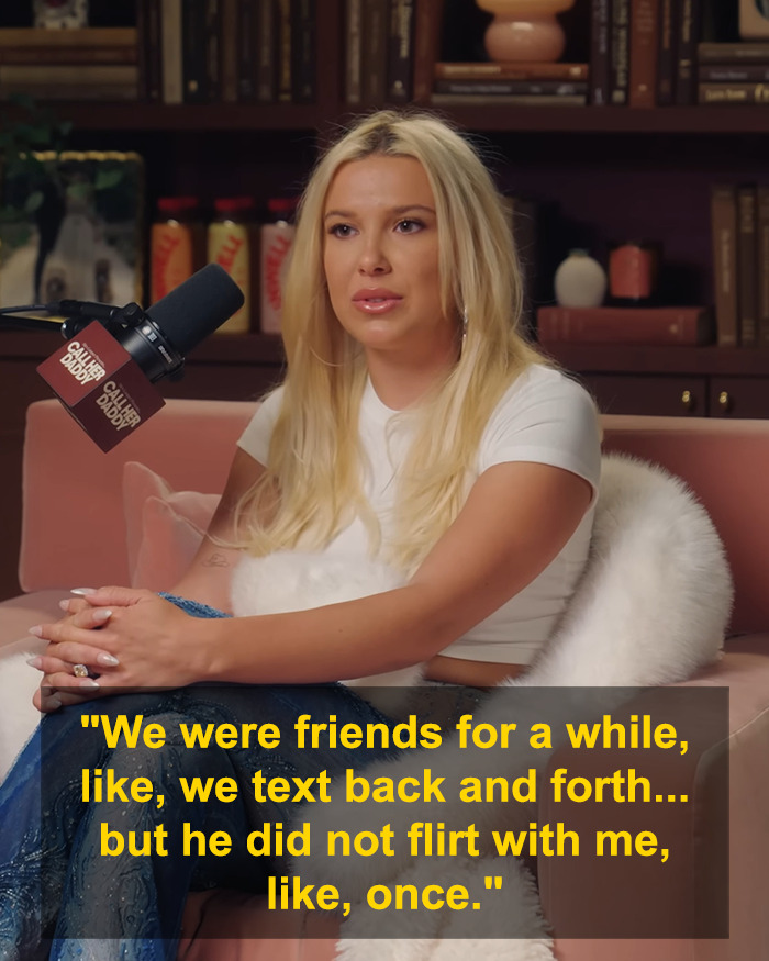 A woman with long blonde hair speaking into a microphone during a podcast about Millie Bobby Brown dating Jake Bongiovi.