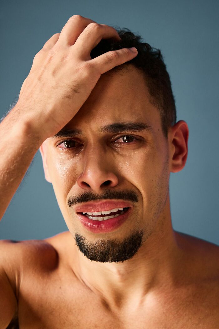 Man with tears and distressed expression illustrating emotions of people who came back to life sharing what dying feels like