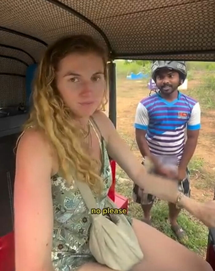 Woman solo traveling records local man's disturbing behavior while seated inside a vehicle, showing concern and discomfort.