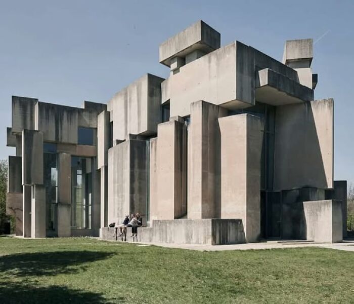Concrete brutalist building with stark geometric shapes, exemplifying ugly and unesthetic architecture in modern design.