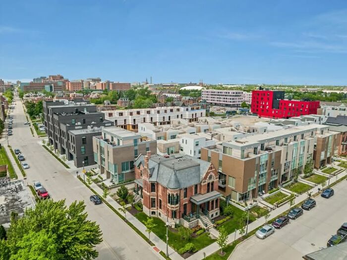 Aerial view of modern architecture with several unesthetic and ugly buildings in an urban neighborhood.