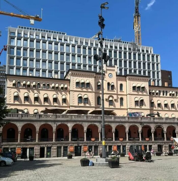 Modern architecture featuring a contrasting mix of unesthetic and ugly building designs under clear blue sky.