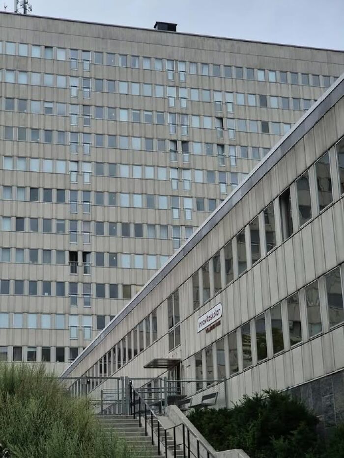 Concrete and glass modern architecture showing unesthetic, ugly, and depressing buildings with repetitive window patterns.