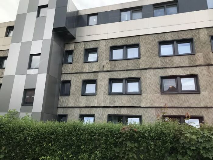 A dull, unesthetic building with outdated design elements, exemplifying ugly modern architecture failing to impress.