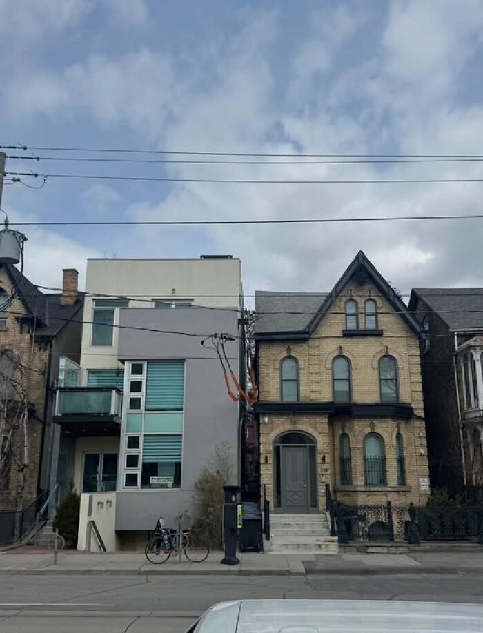 Contrasting ugly and unesthetic buildings side by side, showcasing depressing modern architecture in an urban setting.