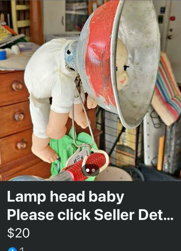 Vintage lamp head baby attached to a metal lamp shade, shown in a cluttered indoor space, FB Marketplace unhinged post.