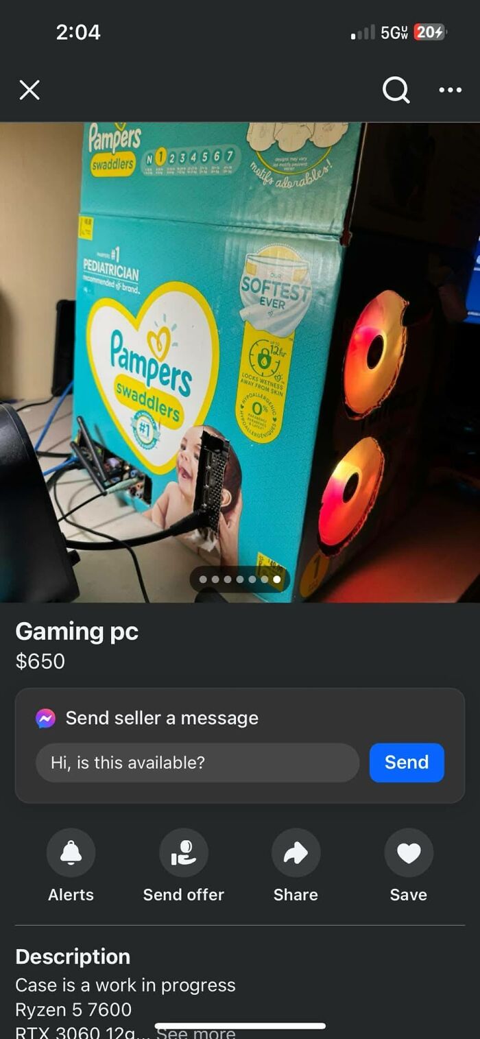 Custom gaming PC built inside a Pampers swaddlers diaper box case listed on FB Marketplace with glowing red fans.