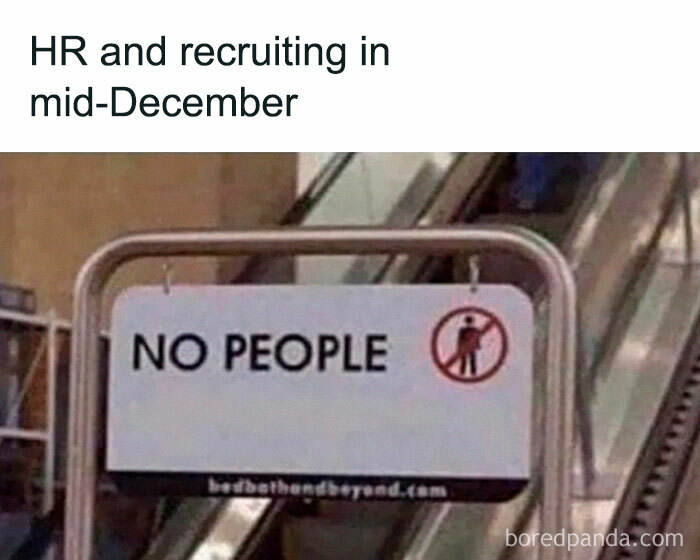 Sign reading no people with escalator in background, illustrating the chaos of working in human resources during mid-December.