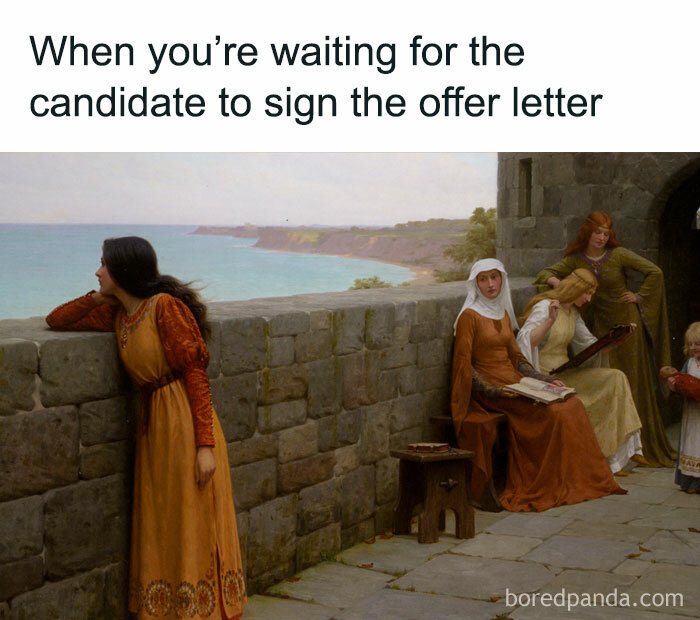 Medieval women waiting by a stone wall near the sea, illustrating the chaos of working in human resources.