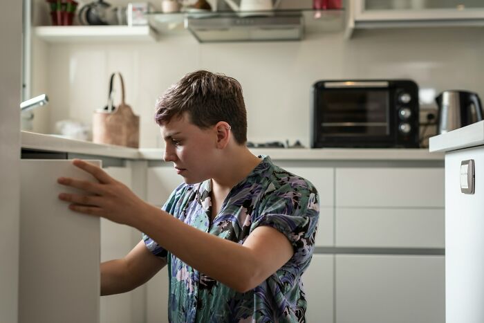 Person discovering surprising habits and secrets about their partner after moving in together at home.