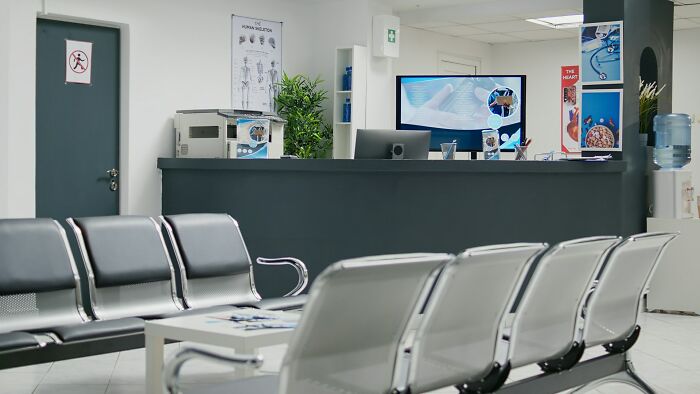 Waiting area with rows of chairs and reception desk, illustrating families where the golden child wasn’t always golden in time.