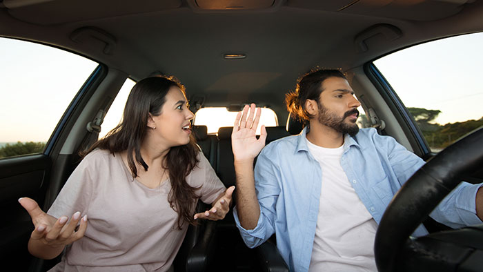 Man and woman arguing inside a car, capturing a funny moment highlighting mocking and clapping back about a job. Man and woman arguing inside a car, capturing a funny moment highlighting mocking and clapping back about a job.