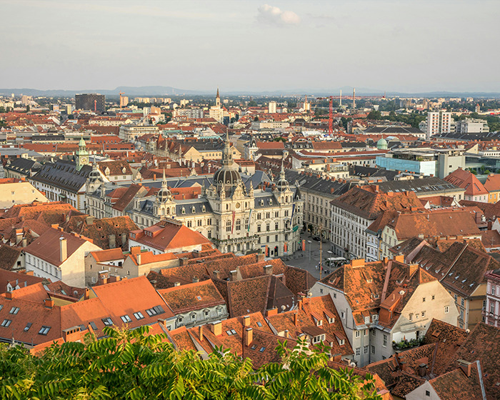 A cityscape with historic buildings and rooftops, illustrating the mystery surrounding influencer vanishing after Christmas party.