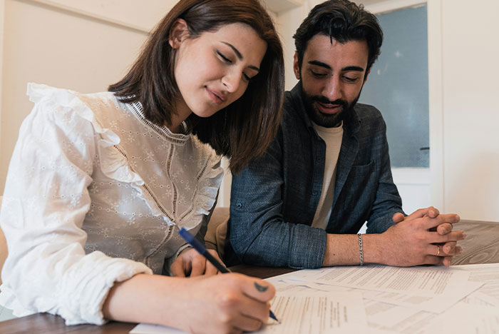 Two people reviewing documents together, illustrating moments when gut instinct was 100% correct.