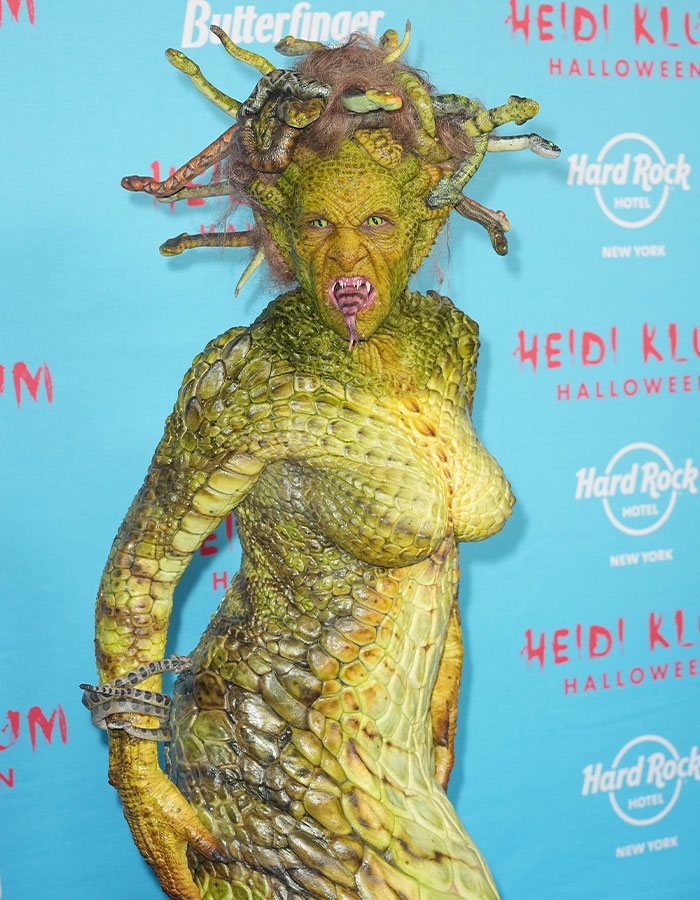 Heidi Klum in a detailed Medusa costume with scales and snakes, revealing her 2025 Halloween look at Hard Rock Hotel event.