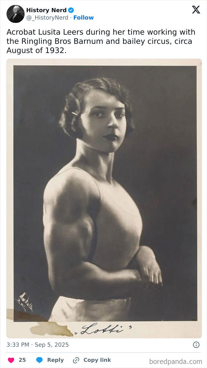 Acrobat Lusita Leers posing strong with muscular arms in a rare and powerful historical black and white photo.