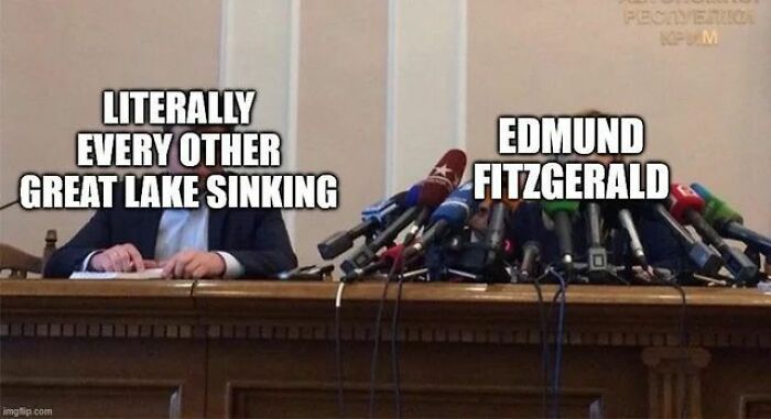 Press conference with many microphones and one person labeled Edmund Fitzgerald, referencing hilarious history memes.