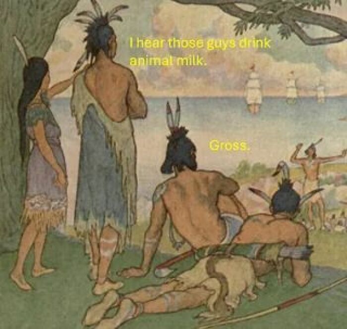 Native Americans observing arriving settlers with caption about drinking animal milk, a hilarious history meme.