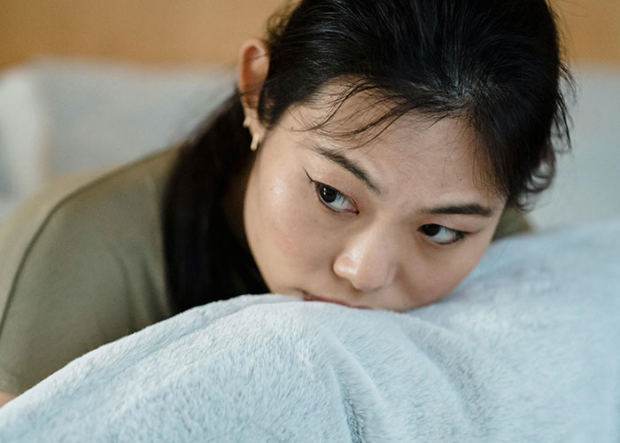 Woman looking upset and deep in thought, reflecting on husband’s betrayal despite his supportive and kind appearance. Woman looking upset and deep in thought, reflecting on husband’s betrayal despite his supportive and kind appearance.