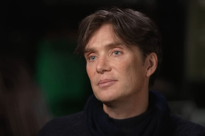 James Franco in a close-up portrait with natural lighting, wearing a dark sweater, appearing thoughtful in an interview setting.