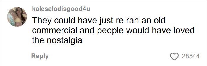 User comment on a Coca-Cola holiday commercial discussing AI and nostalgia, with 28,544 likes shown.