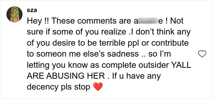 Comment from user sza addressing negativity and a***e, urging kindness and stopping hateful remarks about stretch marks on skin.