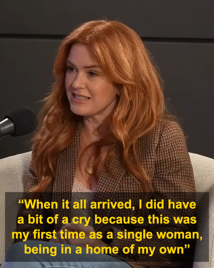 Isla Fisher discussing emotional struggle after difficult divorce with Sacha Baron Cohen in a podcast interview setting.