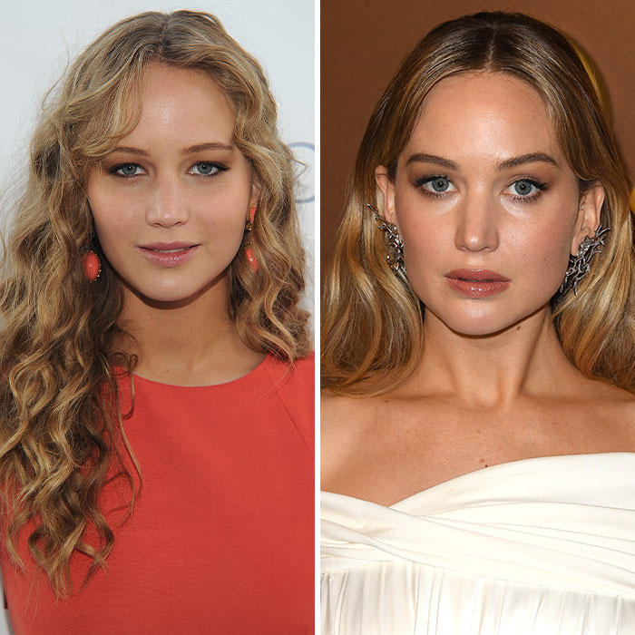 Jennifer Lawrence wearing a white dress and bold earrings amid plastic surgery speculation and diaper dress mockery.