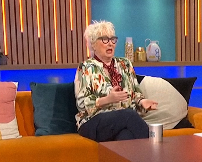 A talk show host reacting on set during a live broadcast after Nick Offerman's x-rated comment causes on-air controversy.