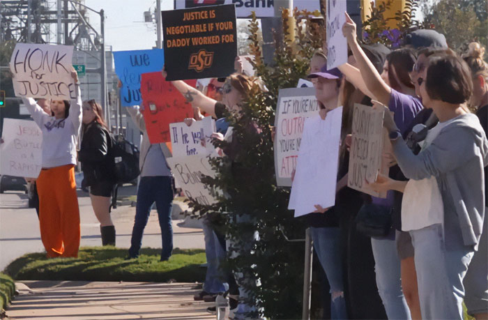 Protests erupt across Oklahoma streets as demonstrators hold signs demanding justice after teen walks free.
